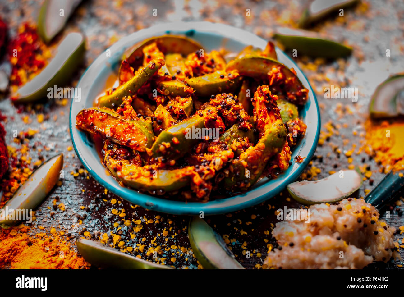 Close up of Aam ka achar or kari ka achar with all its ingredients and