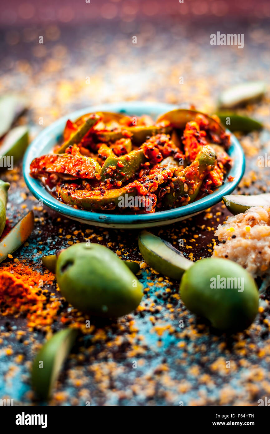 Close up of Aam ka achar or kari ka achar with all its ingredients and