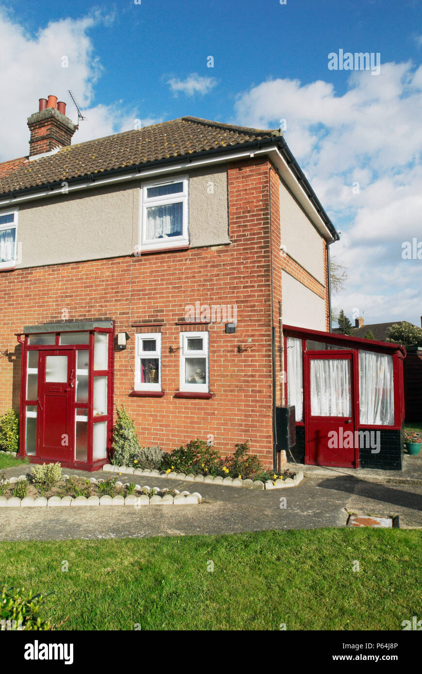 Old porch and lean-to extension on a 1950s semi-detached house, Ipswich, UK Stock Photo
