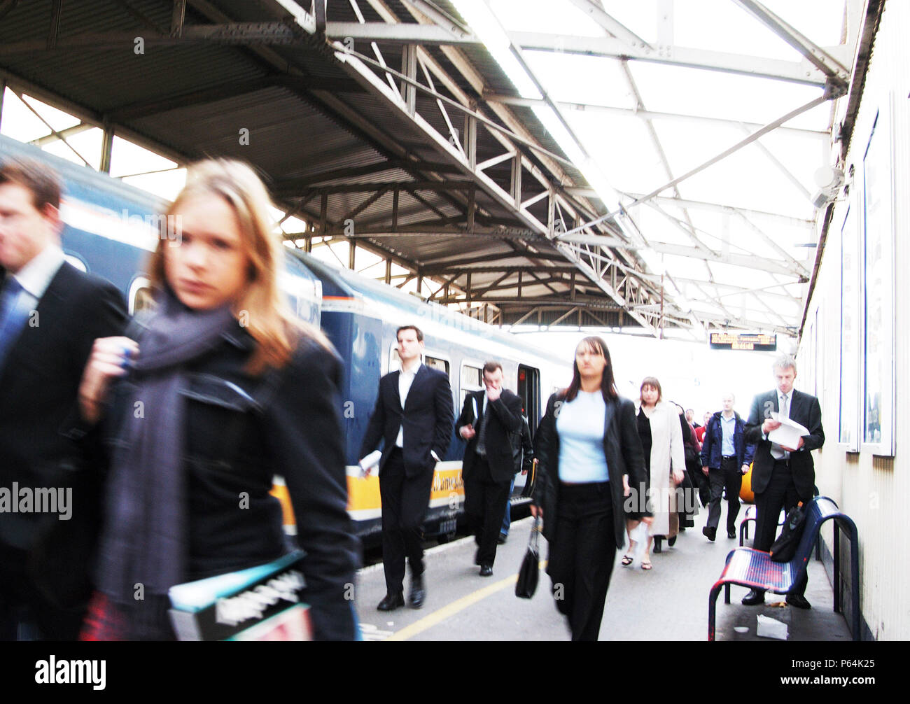 Commuters departing a busy London train station Stock Photo