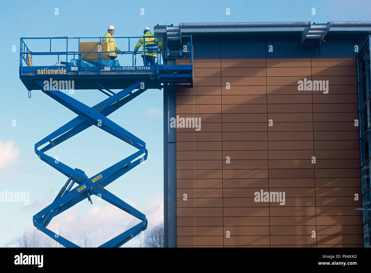 Blue scissor lift hi-res stock photography and images - Alamy