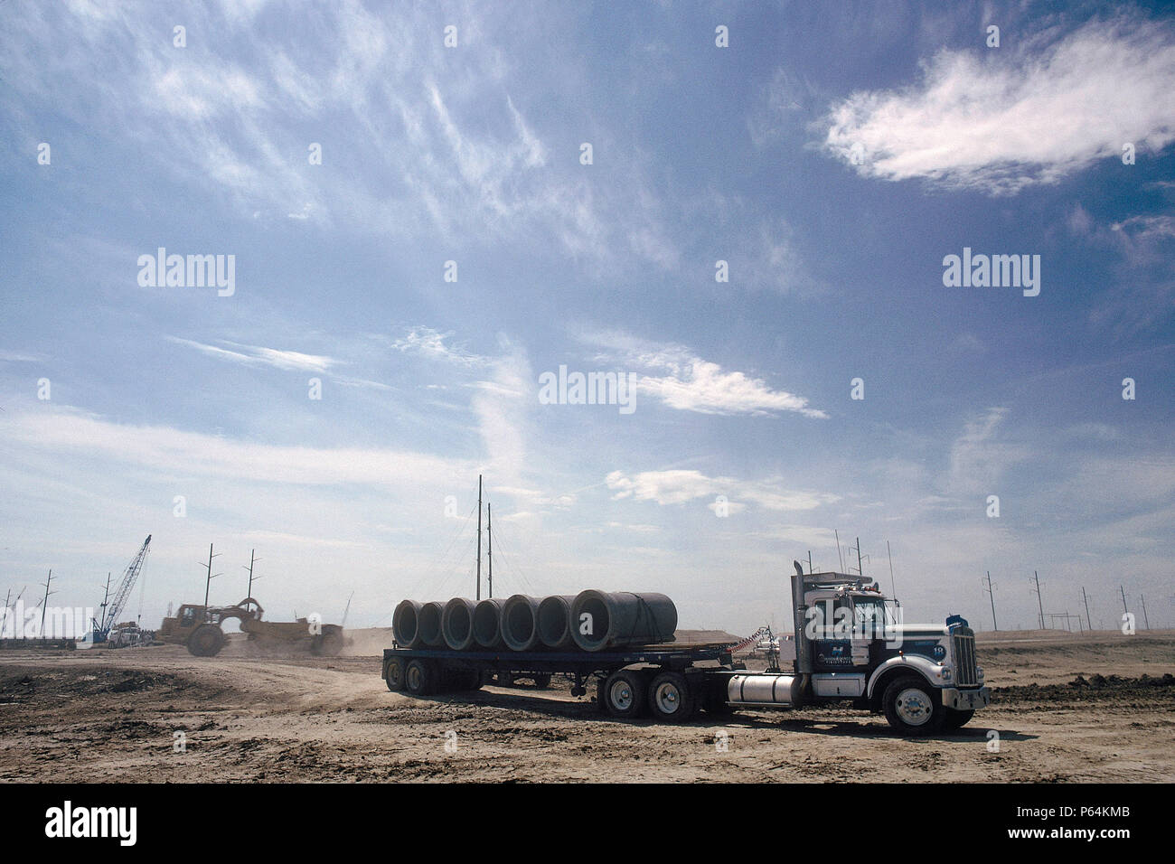 Delivery of pipes. Denver Airport runway construction, Colorado, USA. Stock Photo