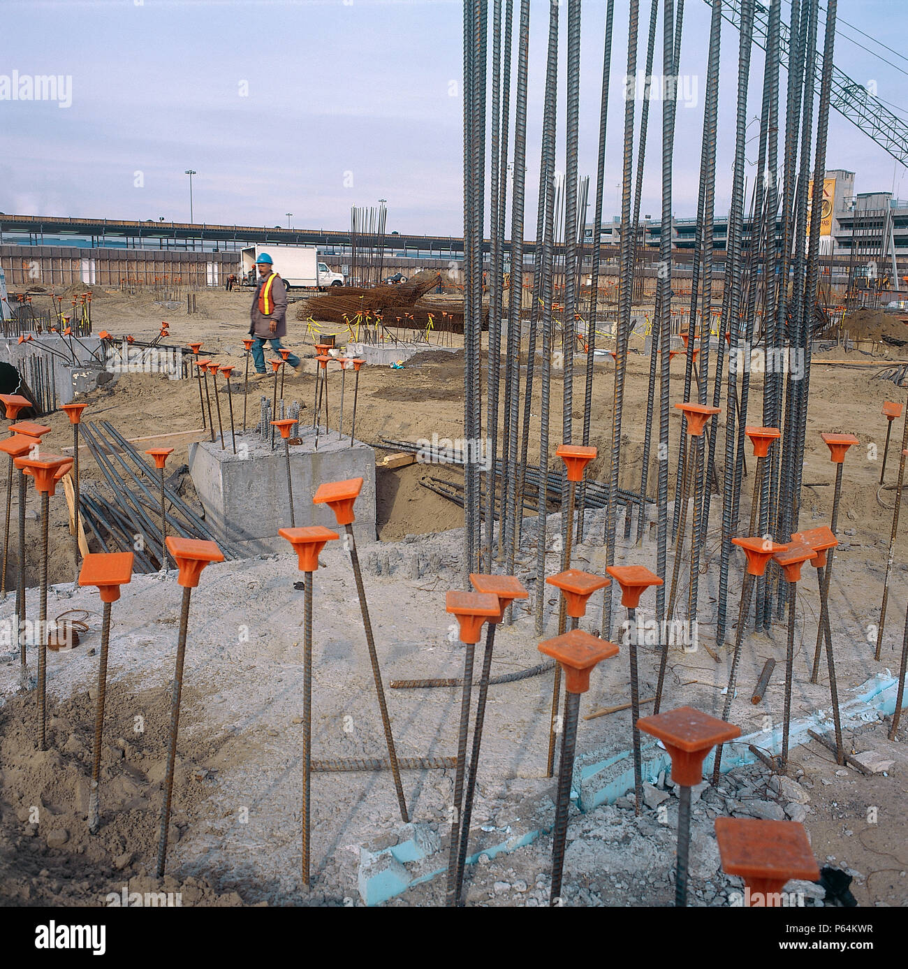 Steel reinforcement bars protected by plastic safety caps. John F