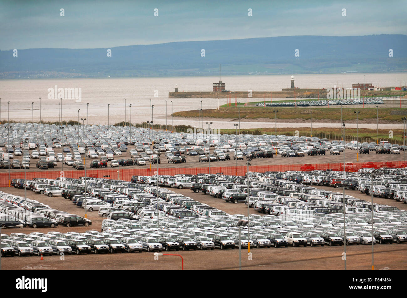 New Suzuki cars and vans parked at Avonmouth docks near Bristol, UK Stock Photo