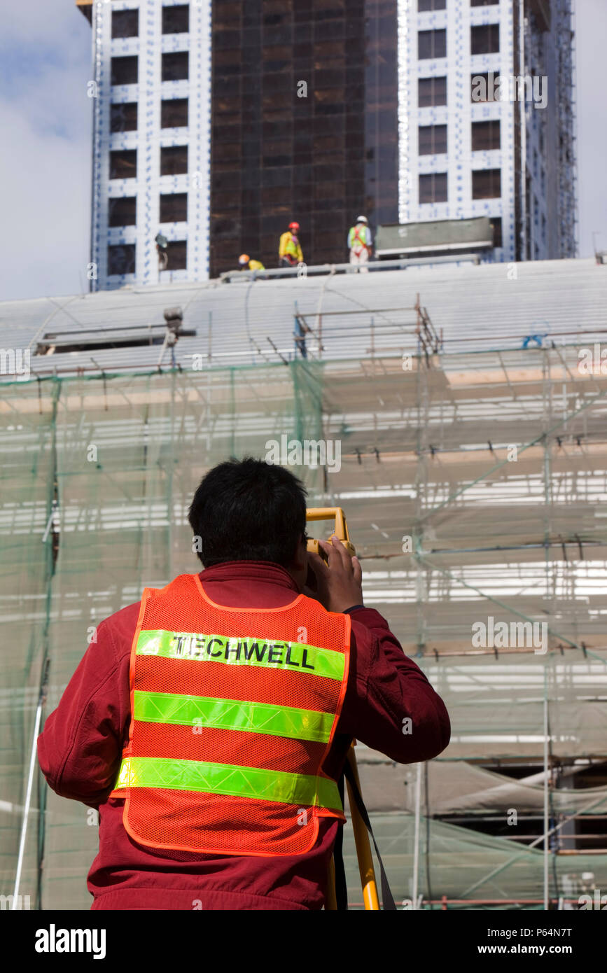 A surveyor working on a construction project in Dubai Stock Photo