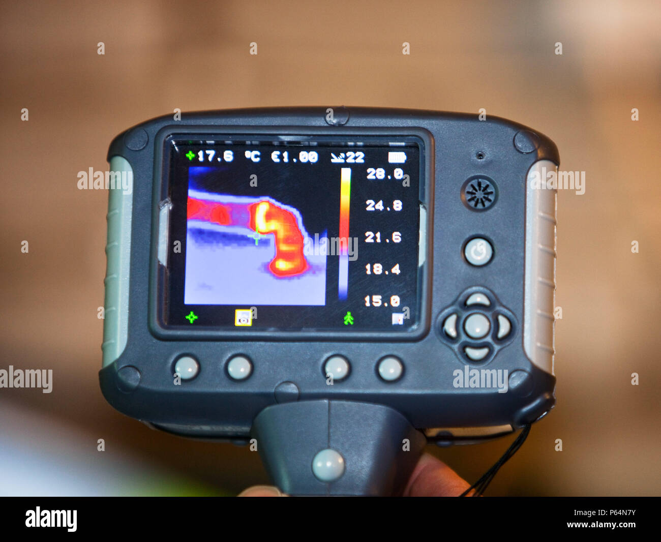 A thermal imaging camera shows heat loss from a hot water pipe Stock