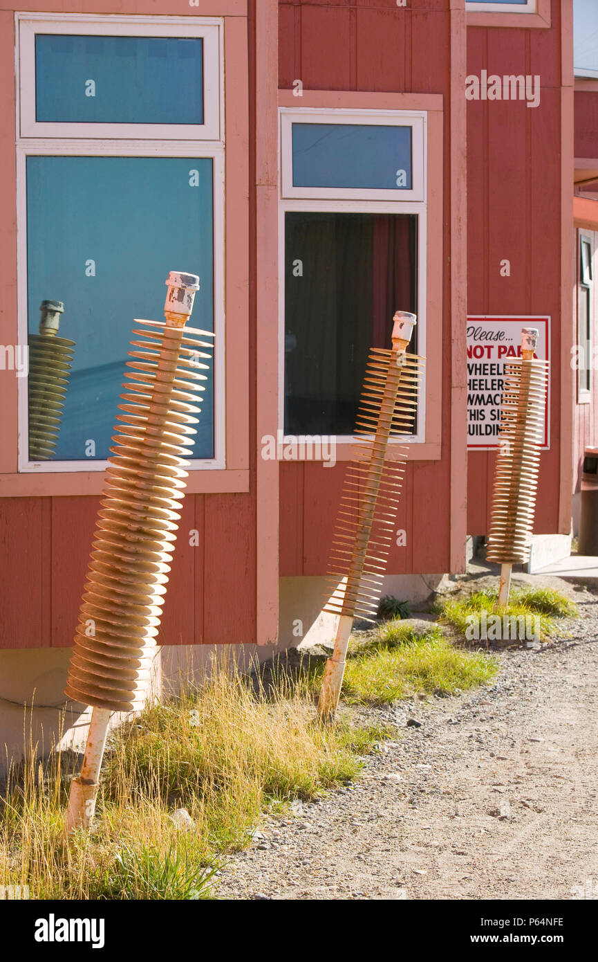 Thermopiles in Kotzebue Alaska designed to keep the permafrost frozen beneath buildings. Temperatures have rocketed in Alaska due to global warming le Stock Photo