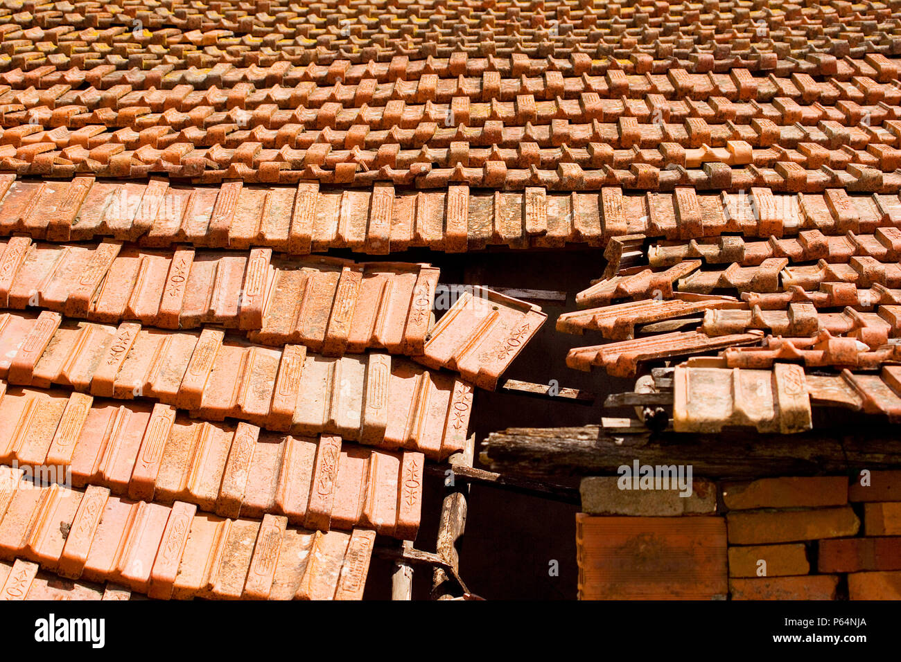 Damaged roof with tiles falling down Stock Photo Alamy
