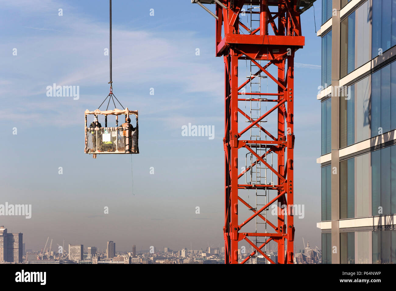Tower crane lifting cage, London, UK Stock Photo Alamy