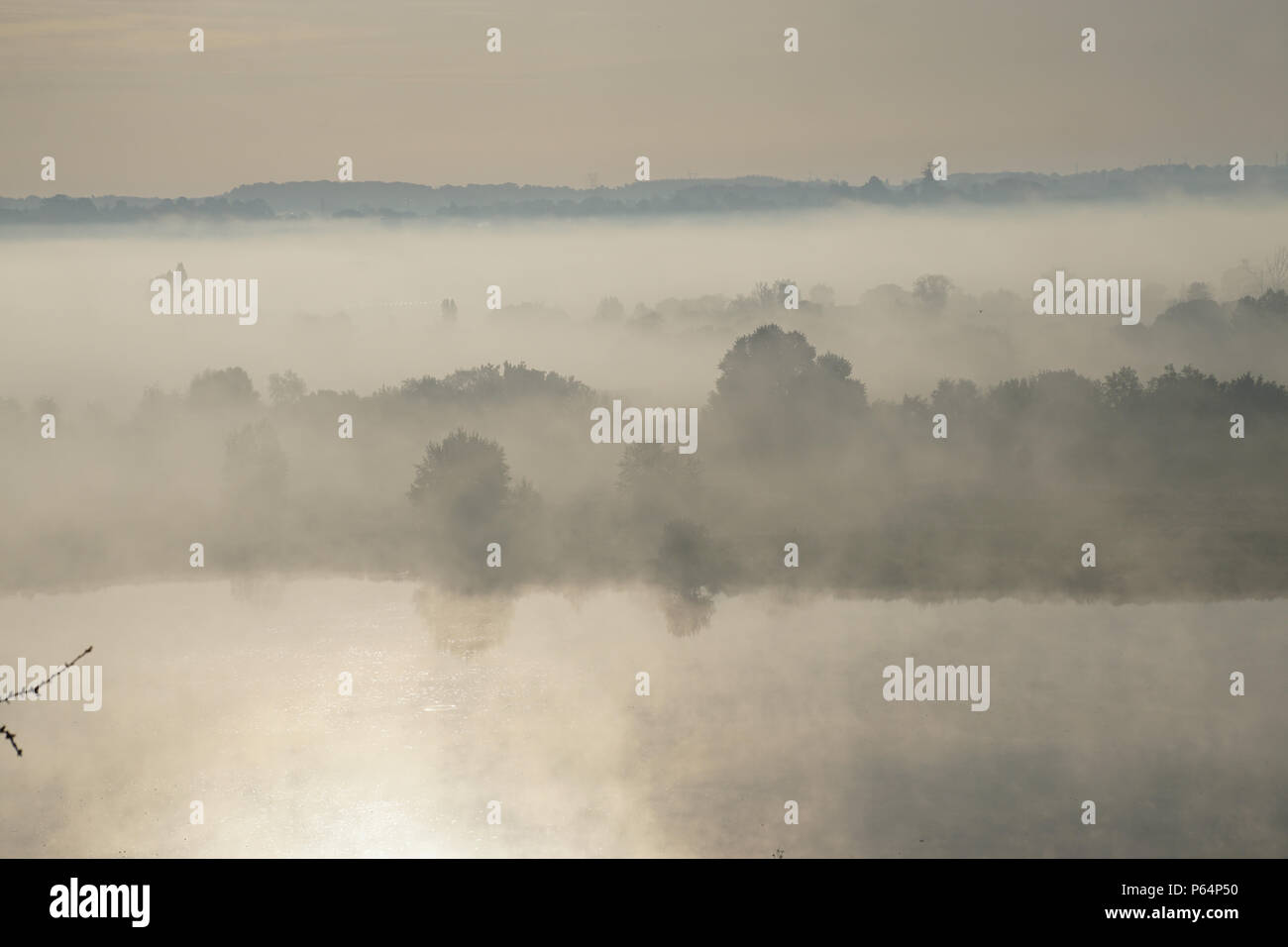 Early morning fog lifting on the river Loire on a clear spring day Stock Photo