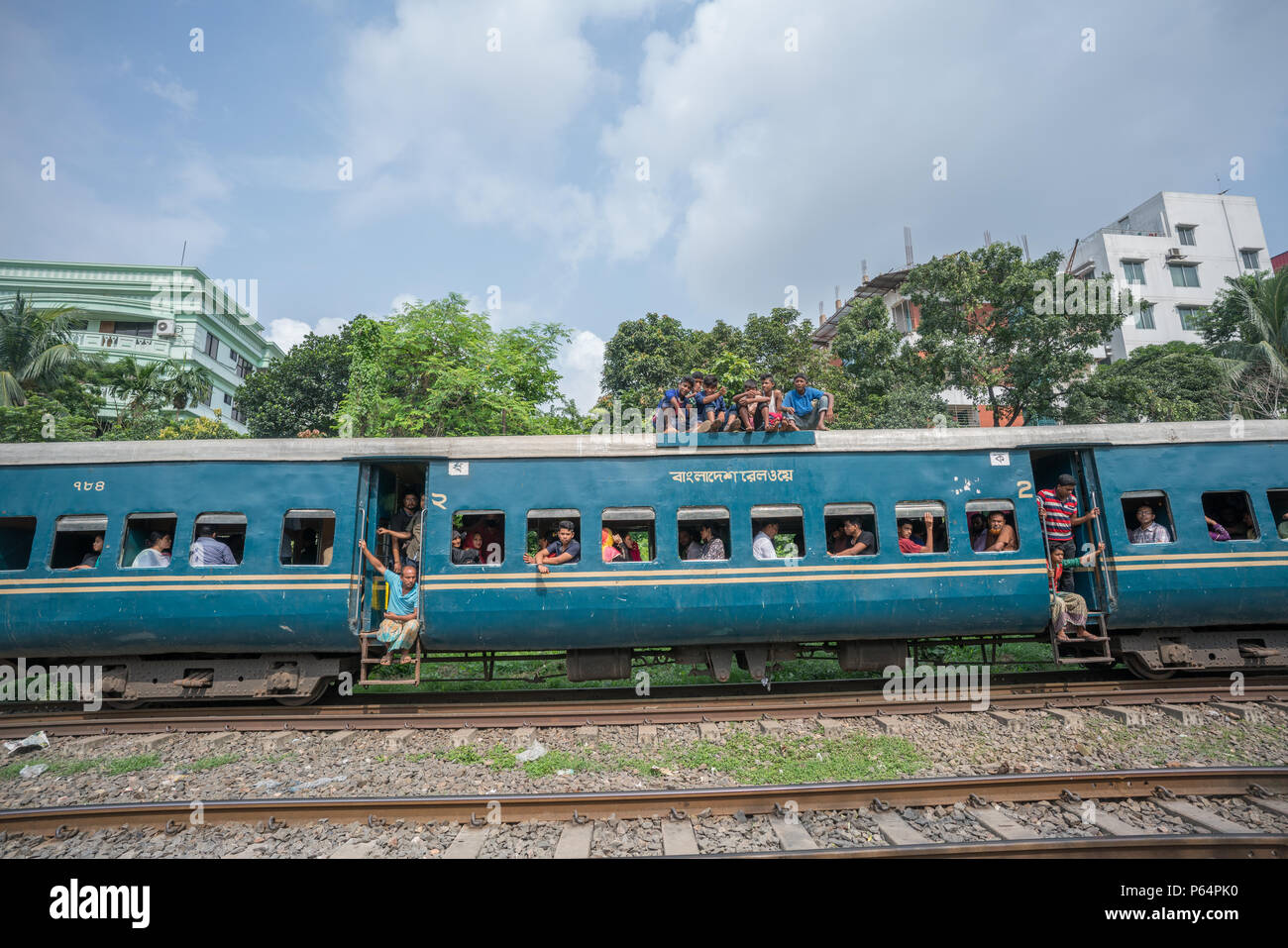 Passengers on top of a train in Dhaka, Bangladesh Stock Photo