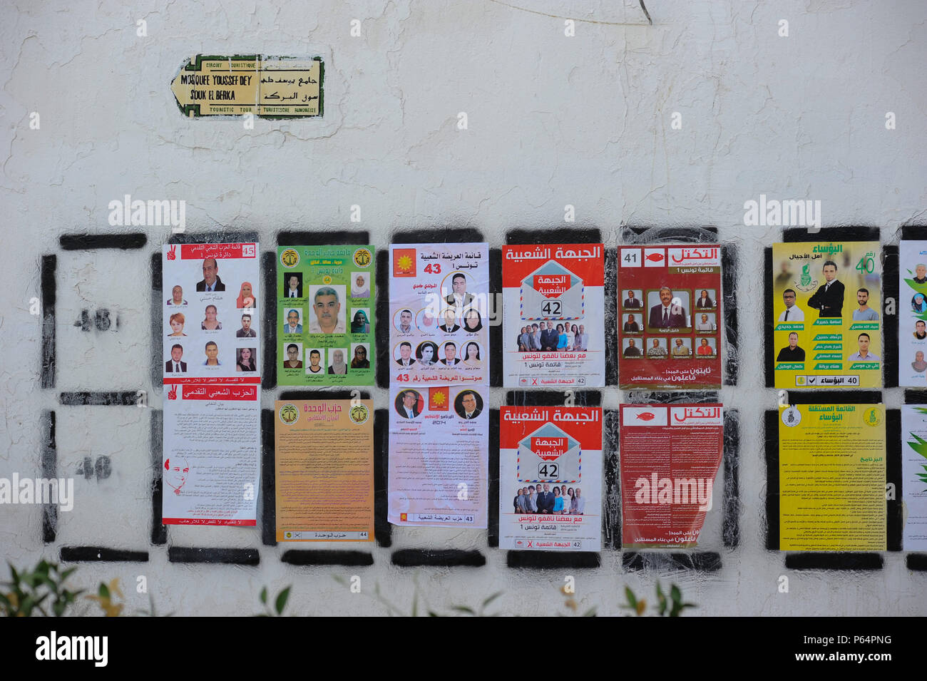 October 17, 2014 - Tunis, Tunisia: Dozens of campaign posters appear on dedicated walls across Tunisia as the North African nation prepares to hold a series of legislative and presidential elections. The first vote, set to take place on October 26, is seen as a critical step for the country's fragile transition to democracy. Affiches electorales pour les differents partis en competition pour les legislatives de 2014 sur les murs de Tunis.*** FRANCE OUT / NO SALES TO FRENCH MEDIA *** Stock Photo