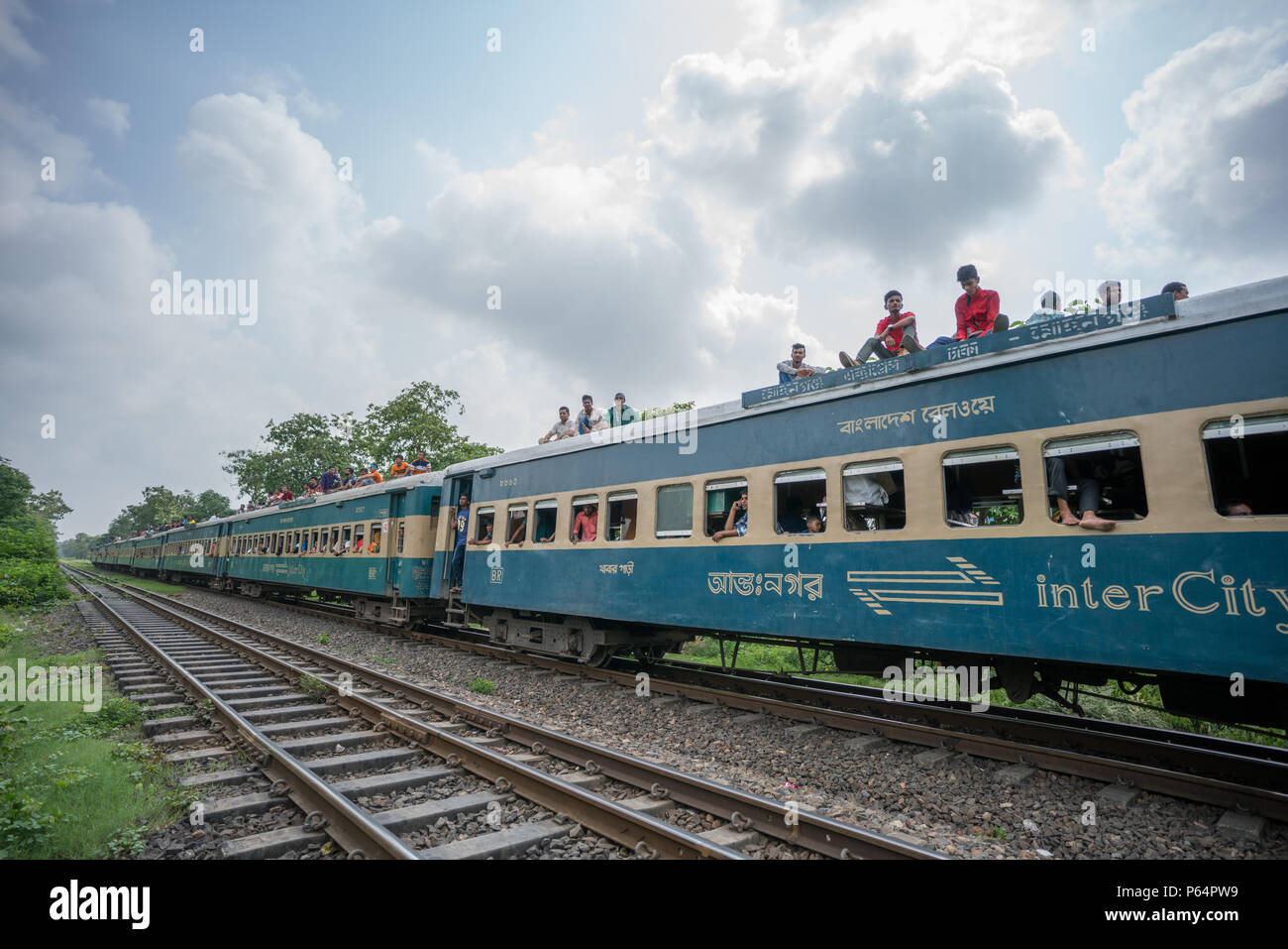 Passengers on top of a train in Dhaka, Bangladesh Stock Photo
