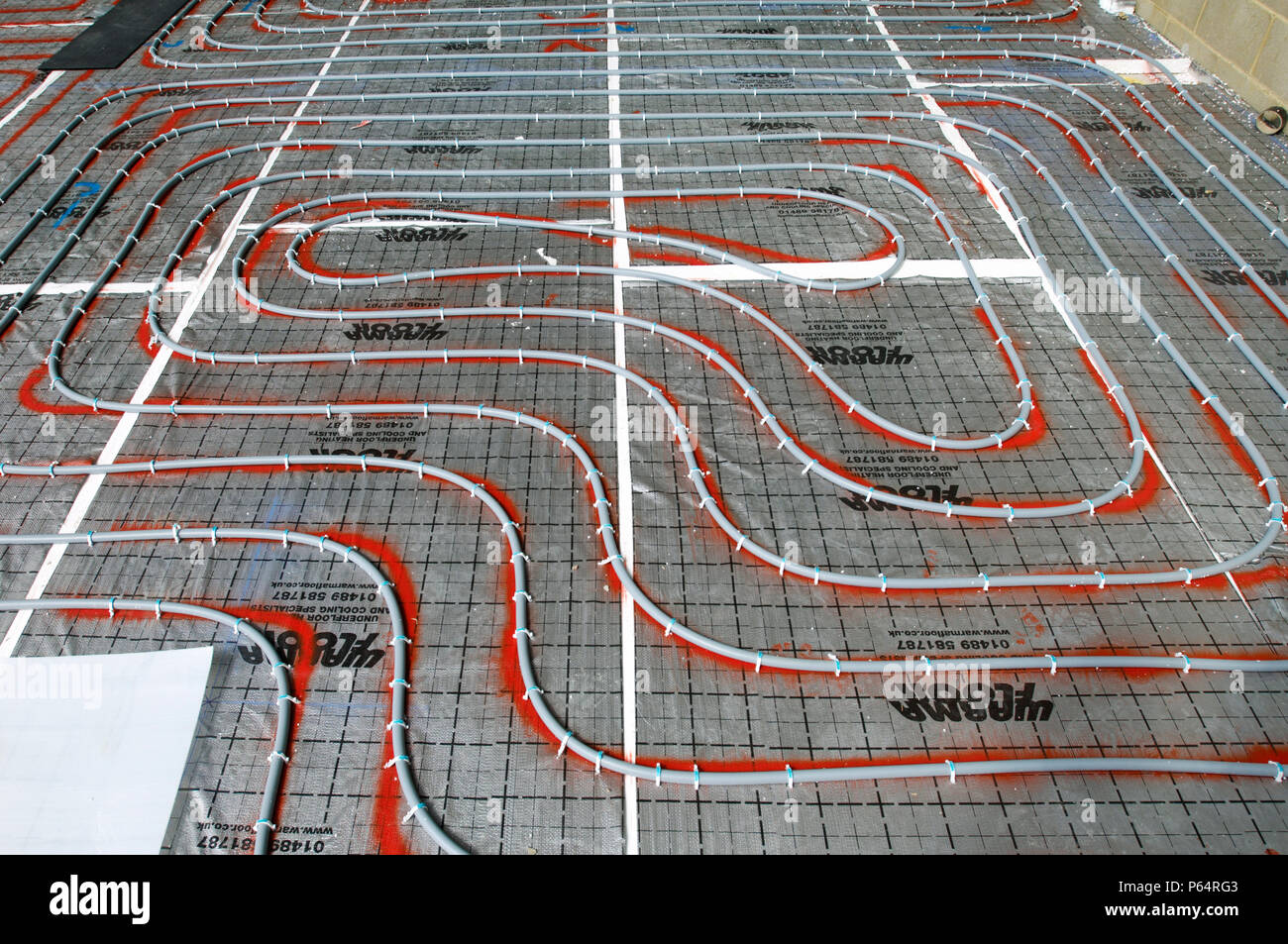 underfloor heating cables installed on construction site Stock Photo