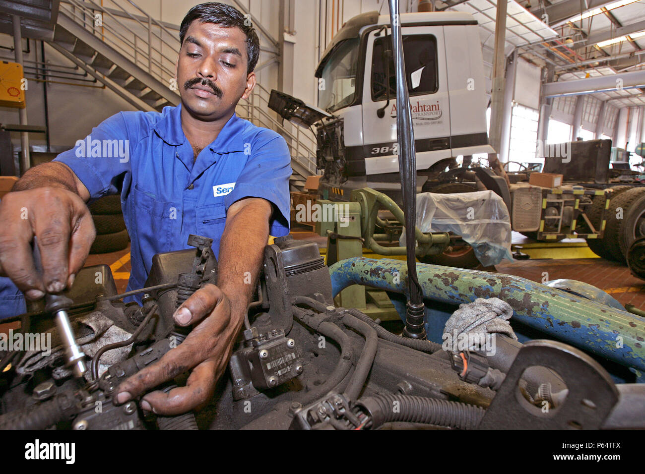 Gargash Motors, Al Qouz,Truck  Mechanics Dubai, United Arab Emirates, June 2007. Stock Photo