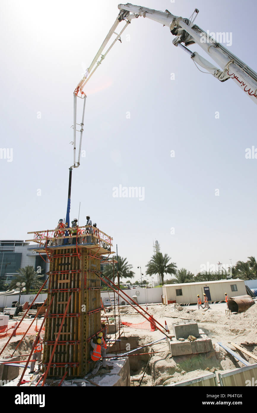Mixer uploading concrete into MRT post at the corner of Ettihad and Al Wahida Street in Abuhail, Dubai, United Arab Emirates, May 2007. Stock Photo