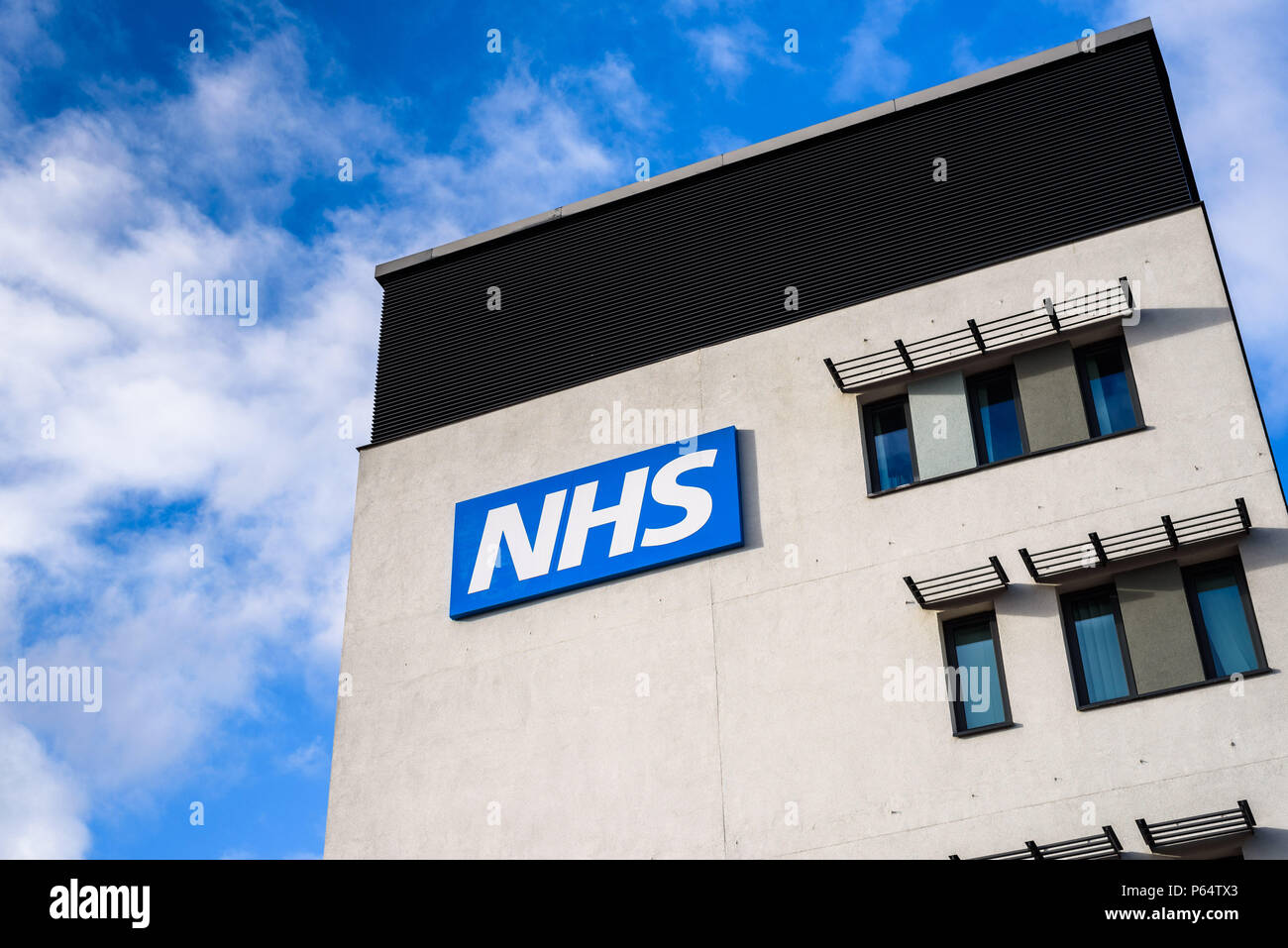 WARRINGTON, UK - MARCH 6, 2016: View of the NHS (National Health Service)  logo at the Springfields Medical Centre in the centre of Warrington, Cheshire Stock Photo