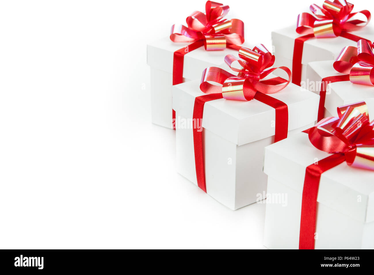 White gift boxes with red ribbons and bows on gray Stock Photo Alamy