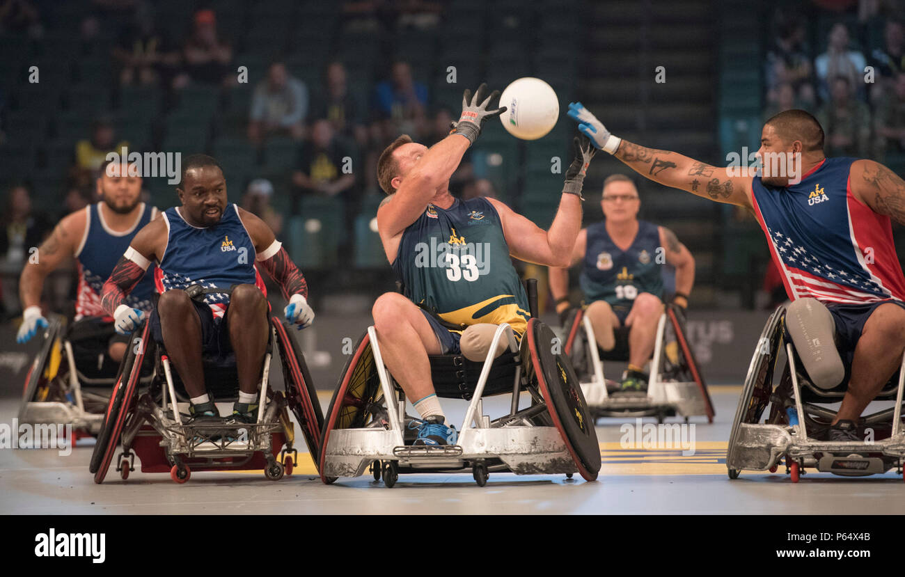 U.S. Marine Corps veteran Alex Nguyen reaches for the as the team defeats Australia in their semi-final wheelchair rugby match during Invictus Games 2016 at the ESPN Wide World of