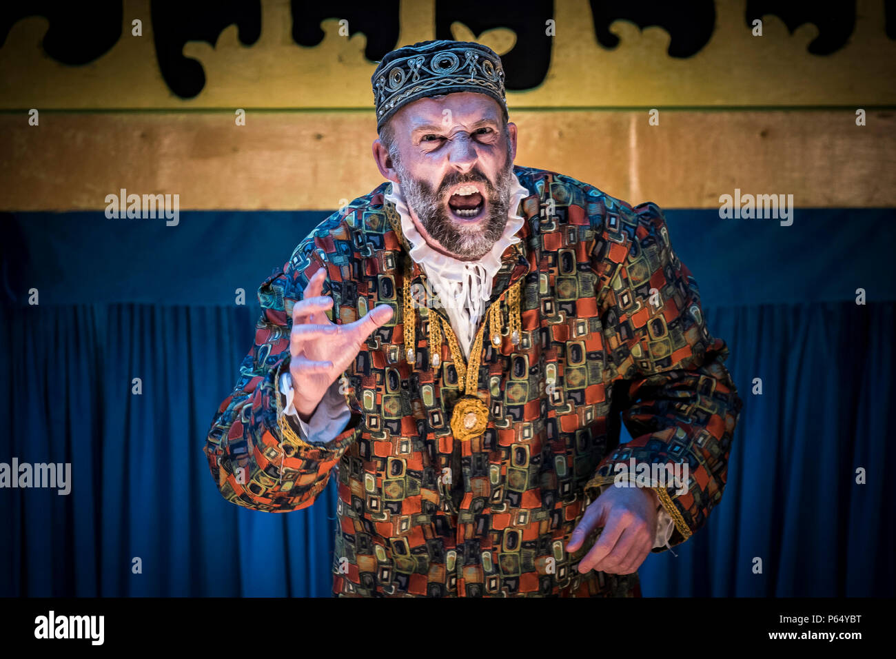 A performance of The Merchant of Venice by Illyria Theatre at Trebah Garden Amphitheatre in Cornwall with David Sayers as Shylock. Stock Photo
