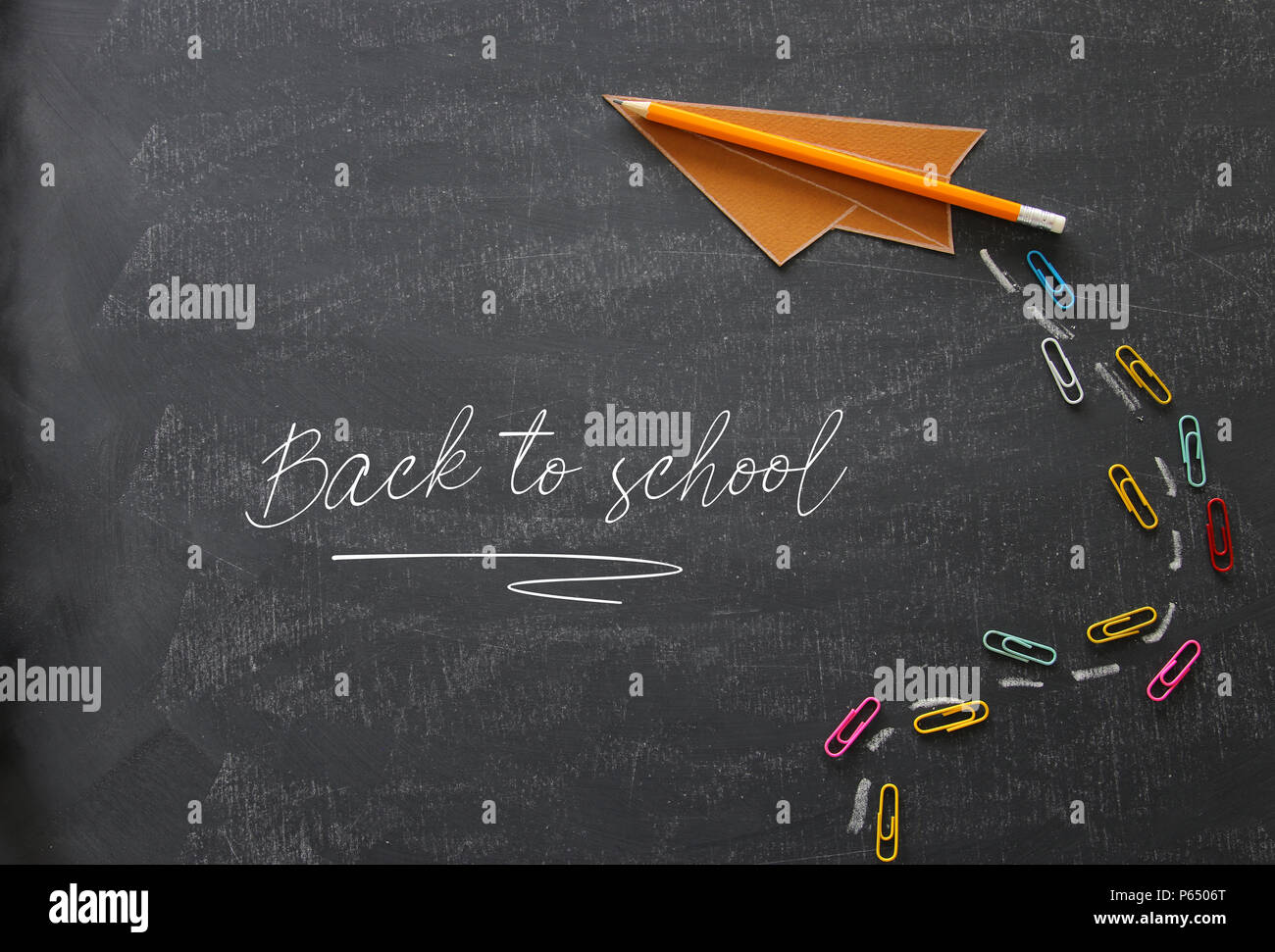 Top view image of paper plane over classroom blackboard background Stock  Photo - Alamy