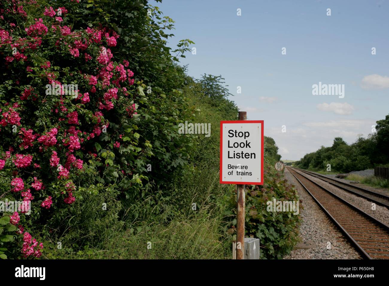 Warning sign on the foot crossing at Elton and Orston station, Lincolnshire. 2007 Stock Photo