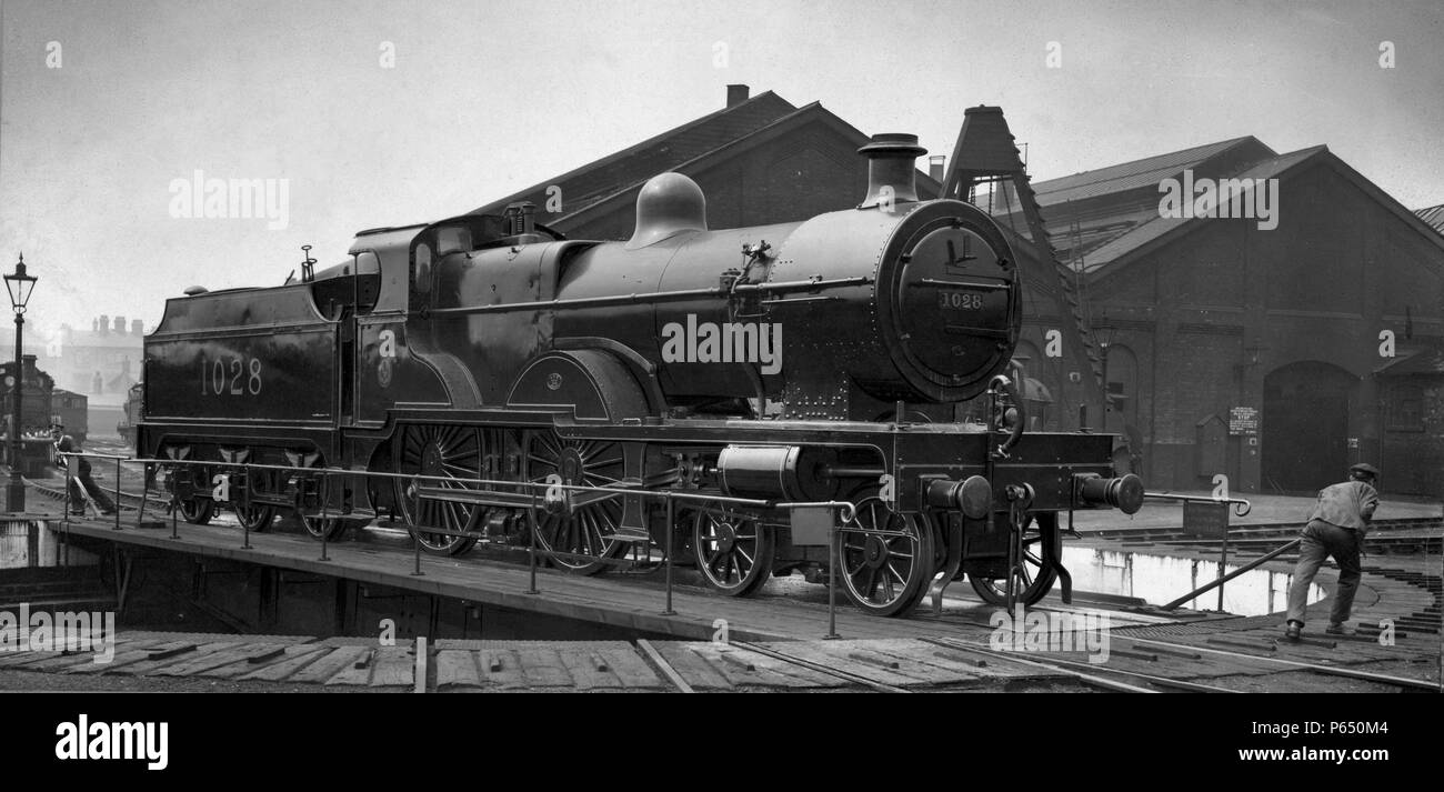 A 4-4-0 Midland Class4P Compound is turned on a manual turntable. C1935 Stock Photo