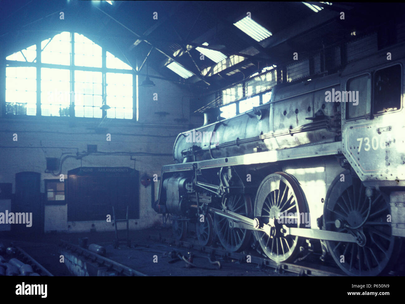 A British Railways Standard 5 Class 4-6-0 on shed with the Engine Arrangement board in the background. Stock Photo