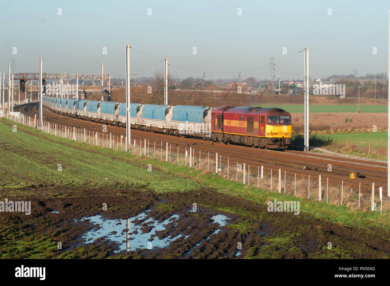 A Class 60 diesel locomotive passes Winwick with a loaded mgr service from Liverpool Docks Bulk Terminal to Fiddlers Ferry. December 2004. Stock Photo