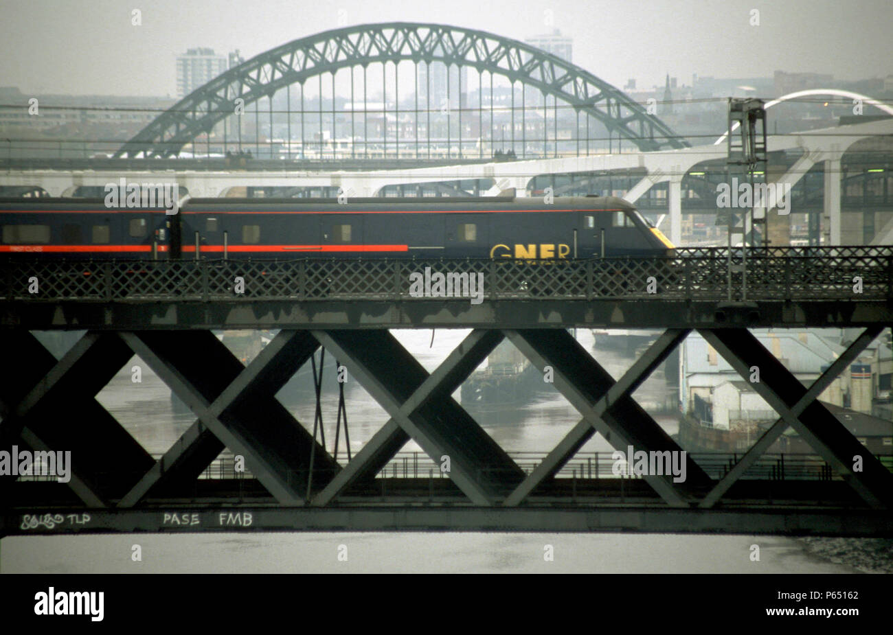 A GNER service from Newcastle crosses the Tyne on the King Edward rail bridge. 2002. Stock Photo