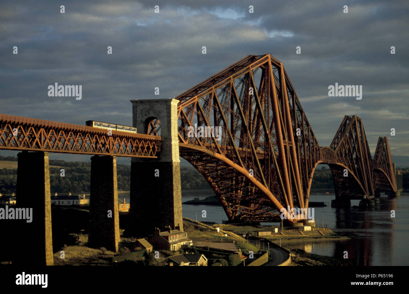 A local train crosses the Forth Bridge over the Firth of Forth. C1993 Stock Photo