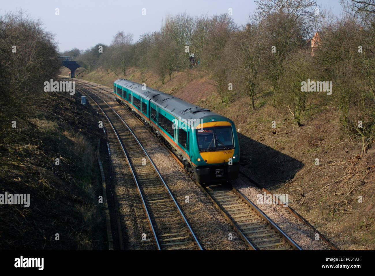 A Midland Mainline class 170 Turbostar train passes through the cutting at Newton Harcourt as it heads for London St Pancras station. April 2004. Stock Photo