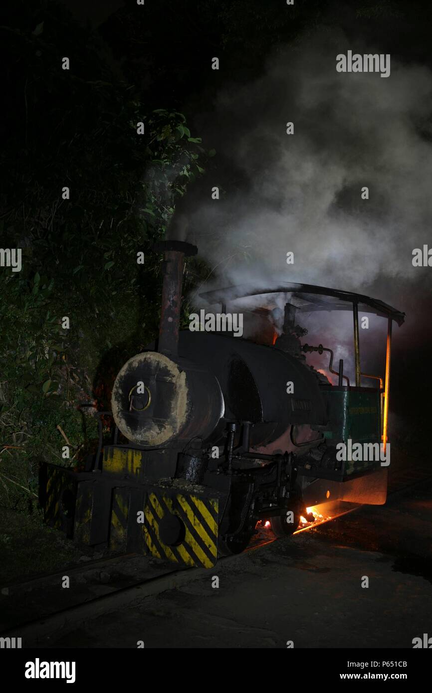 A night scene at Tipong Colliery on the Assam Coalfield featuring 'David'  a 0-4-0ST 600mm gauge built by Bagnalls of Stafford in 1924 Stock Photo