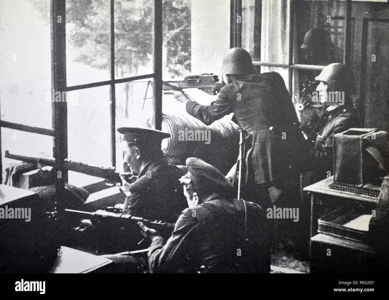 republican soldiers fire from a building during the Spanish civil war, Barcelona 1937 Stock Photo
