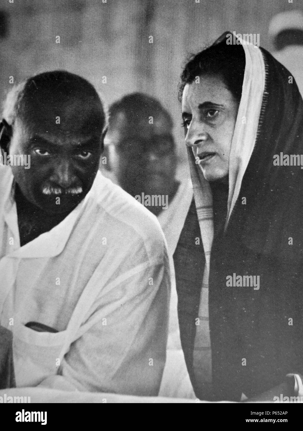 Indira Gandhi Prime Minister of India speaks with a Congress party colleague. Stock Photo