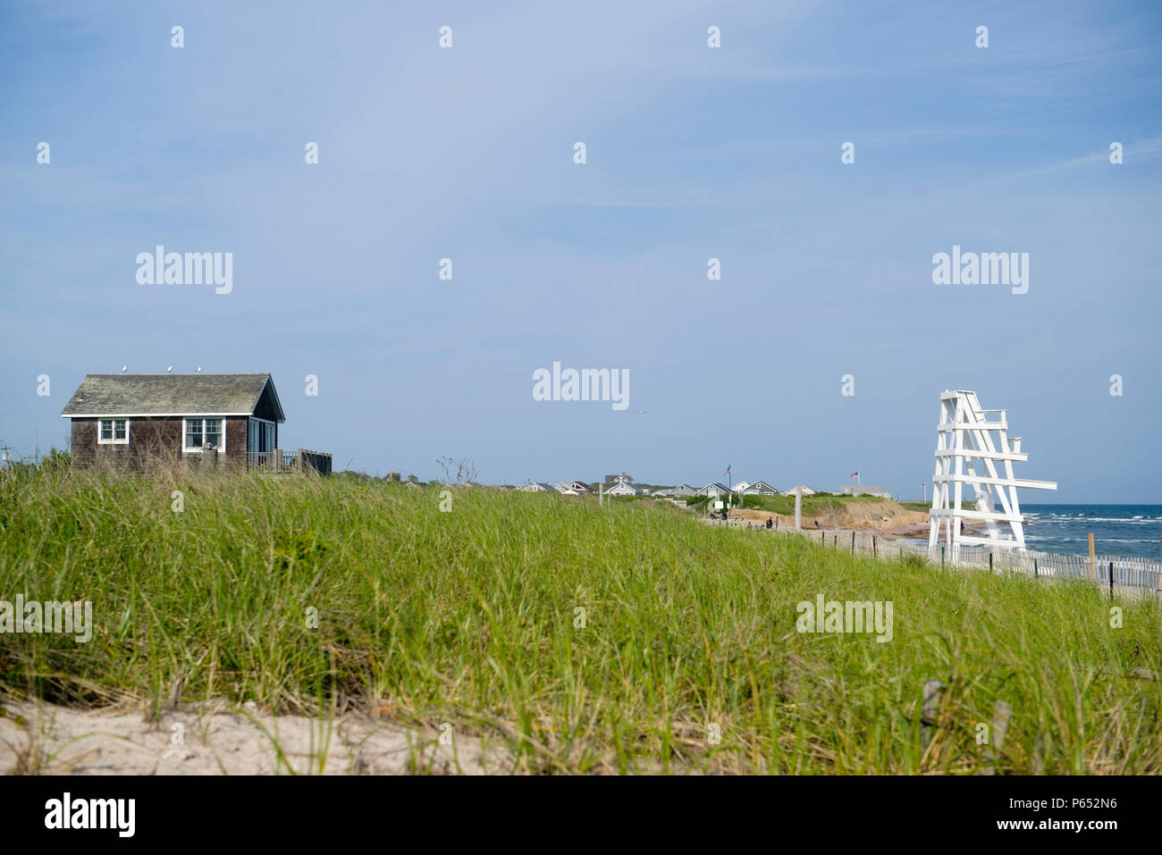 beach scene with beach house scrub brush and lifeguard chair on Ditch Plains Beach Montauk, New York, The Hamptons Stock Photo
