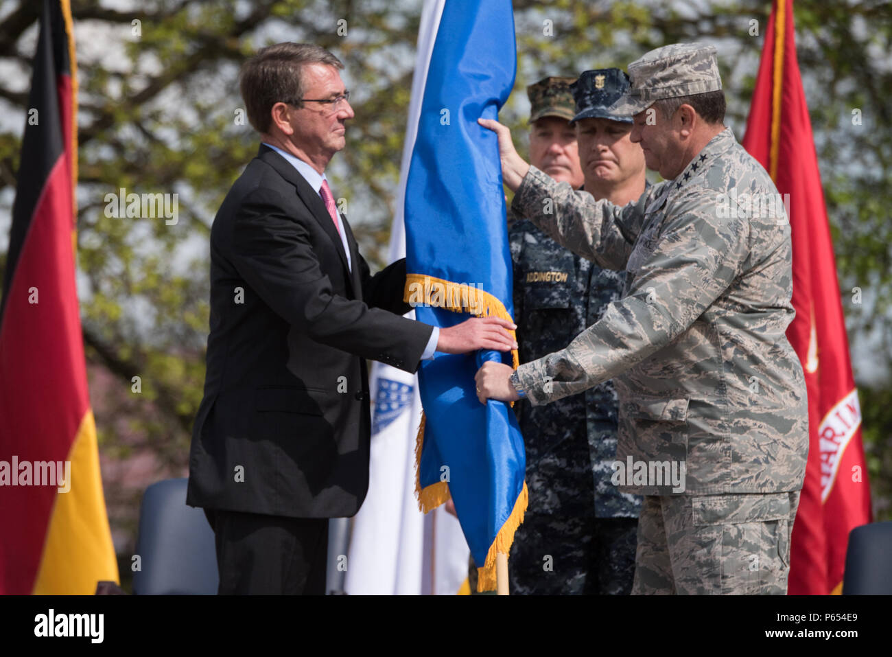 Defense Secretary Ash Carter receives the U.S. European Command flag ...