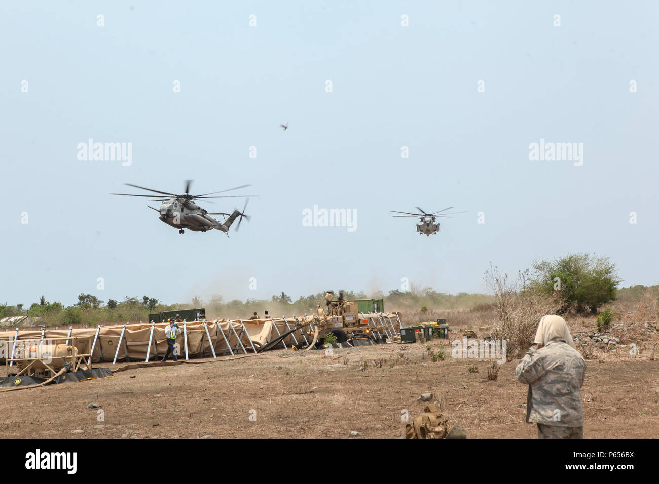 CH-53E Super Stallions refuel and retrieve members of the Joint Rapid ...