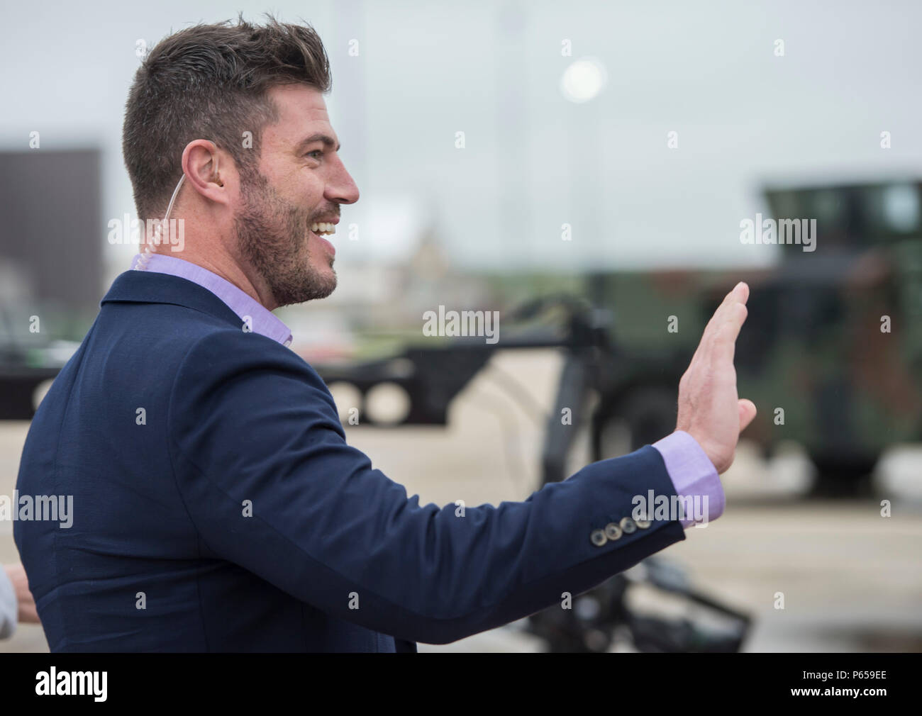 Jesse Palmer, correspondent with ABC’s Good Morning America, greets a crowd of U.S. Airmen at Langley Air Force Base, Va., May 4, 2016. During his visit to Langley, Palmer toured an intelligence unit, received a flight in an F-16 Fighting Falcon and did a live broadcast from the flight line. (U.S. Air Force photo by Senior Airman Kayla Newman) Stock Photo