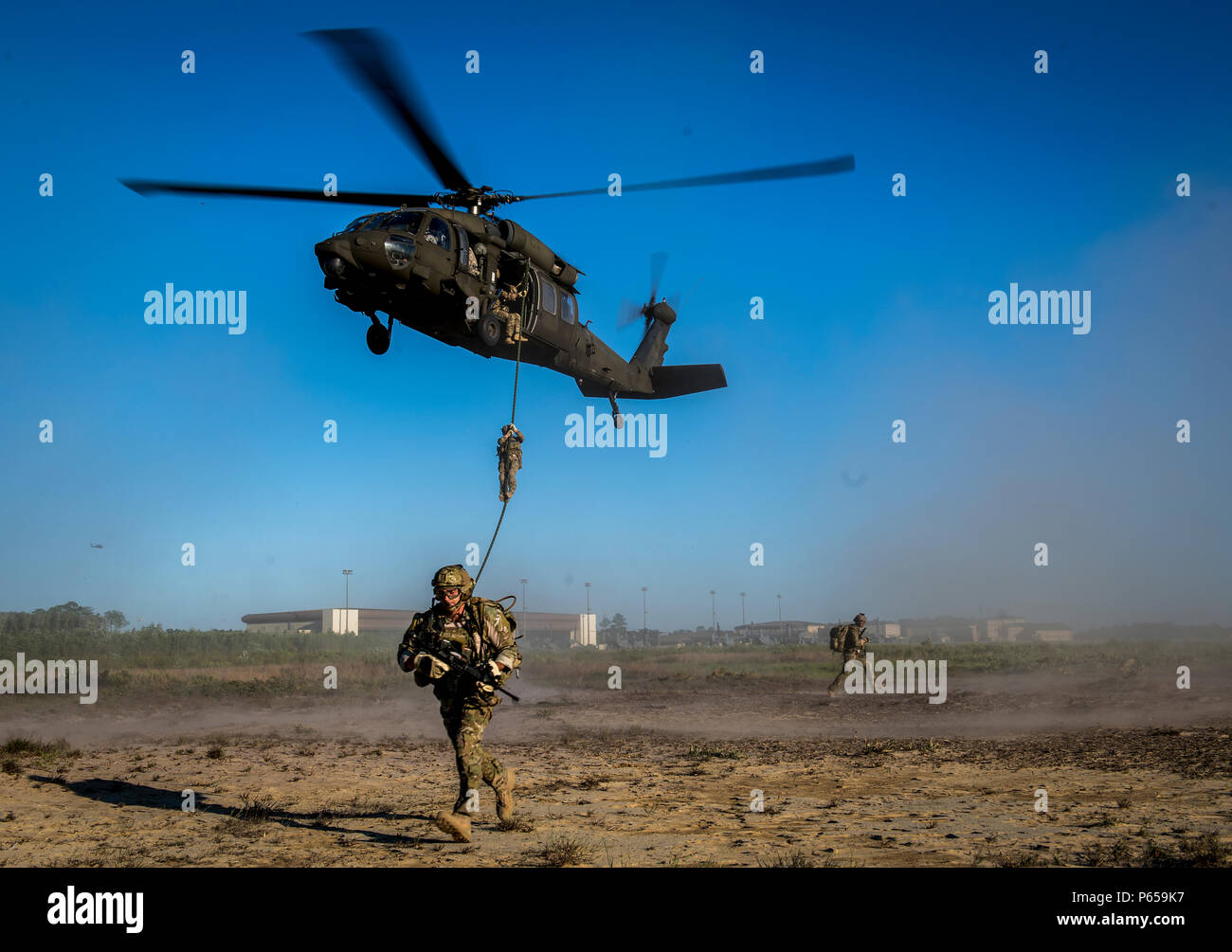 Uh 60 Fast Roping Vector 24th Special Operations Wing Airmen fast-rope from a UH-60 Black Hawk ...