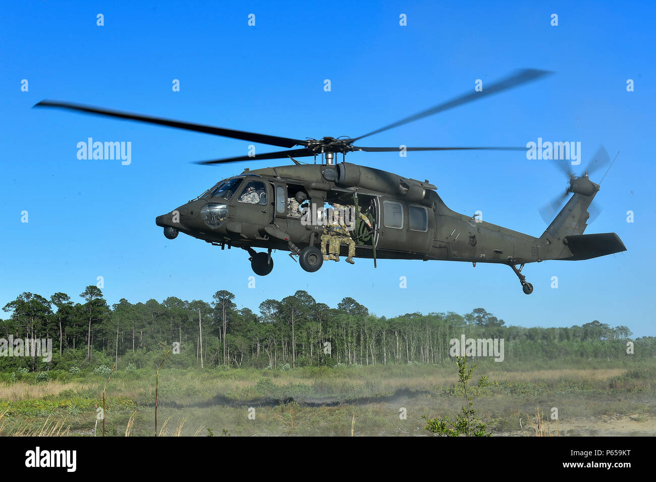 Uh 60 Fast Roping Vector Special Tactics Airmen with the 24th Special Operations Wing fast rope ...