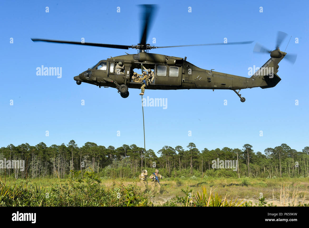 Uh 60 Fast Roping Vector Special Tactics Airmen with the 24th Special Operations Wing fast rope ...