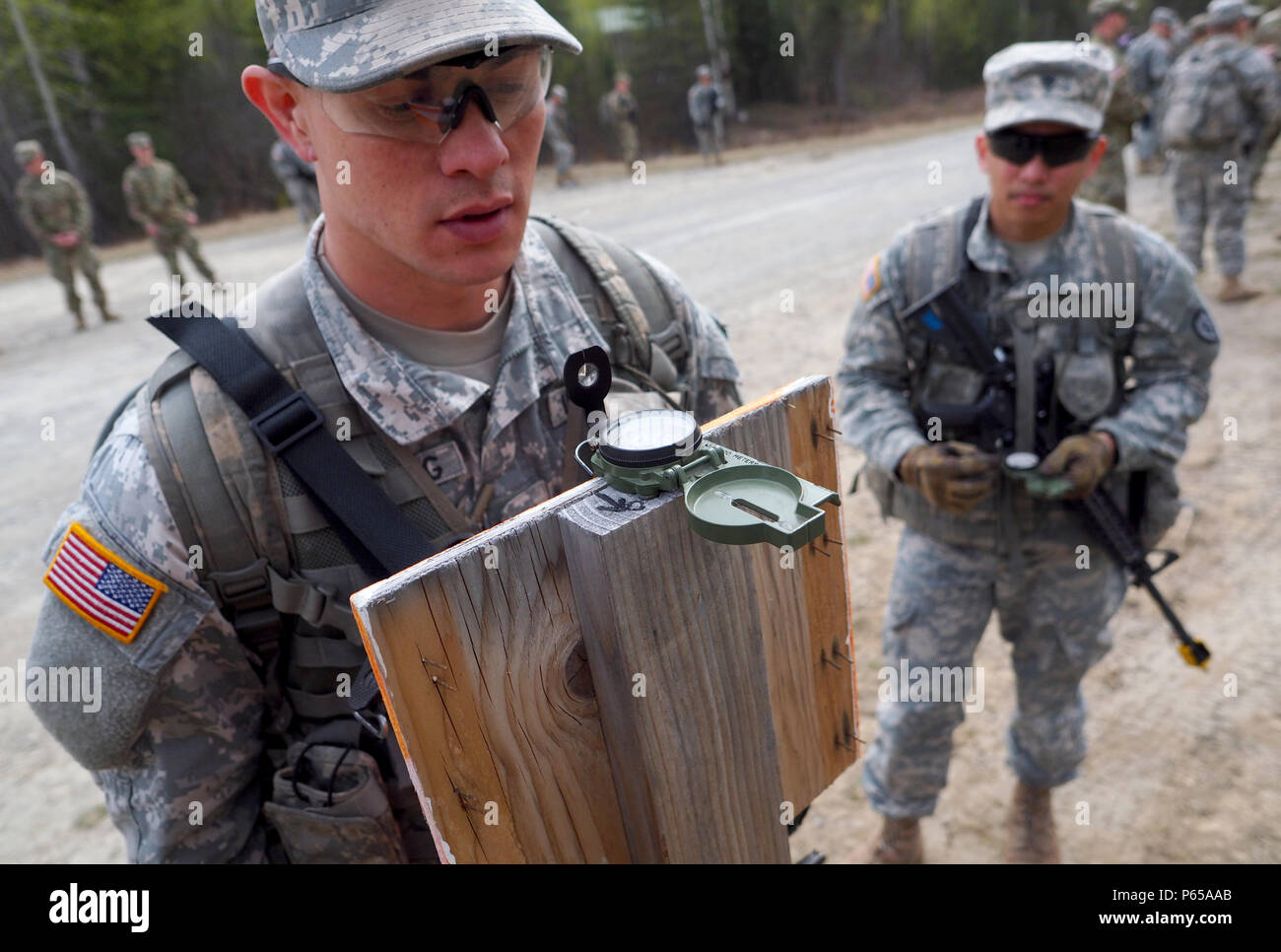 Soldier Using Compass Soldiers from U.S. Army Alaska verify compass accuracy and practice ...