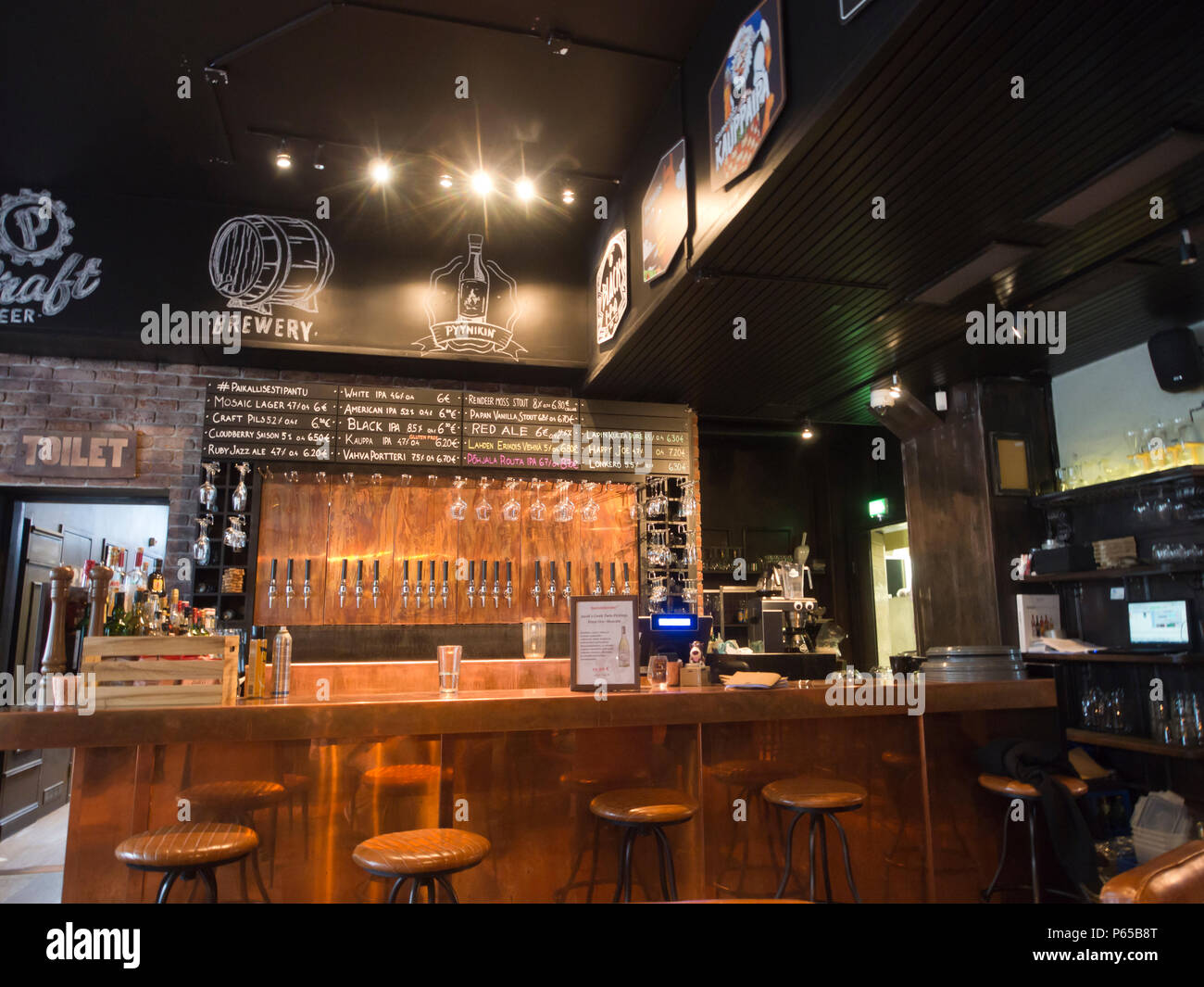 Pyynikin Brewhouse in Tampere finland, interior of pub and restaurant.  Numerous taps at the bar showing the many different beers on offer Stock  Photo - Alamy