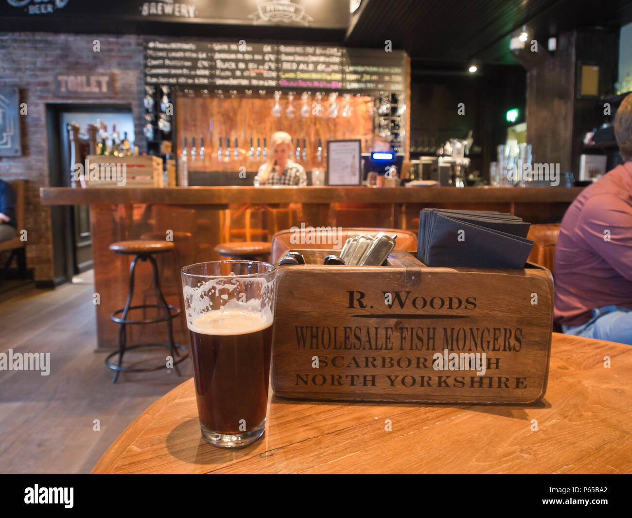 Pyynikin Brewhouse in Tampere finland, interior of pub and restaurant. Numerous taps at the bar