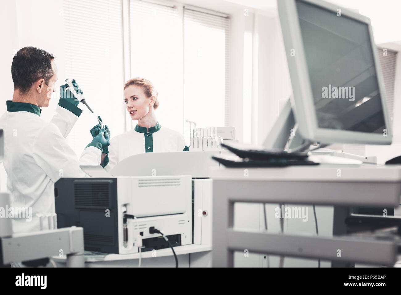 Enthusiastic doctors investigating new analyses Stock Photo