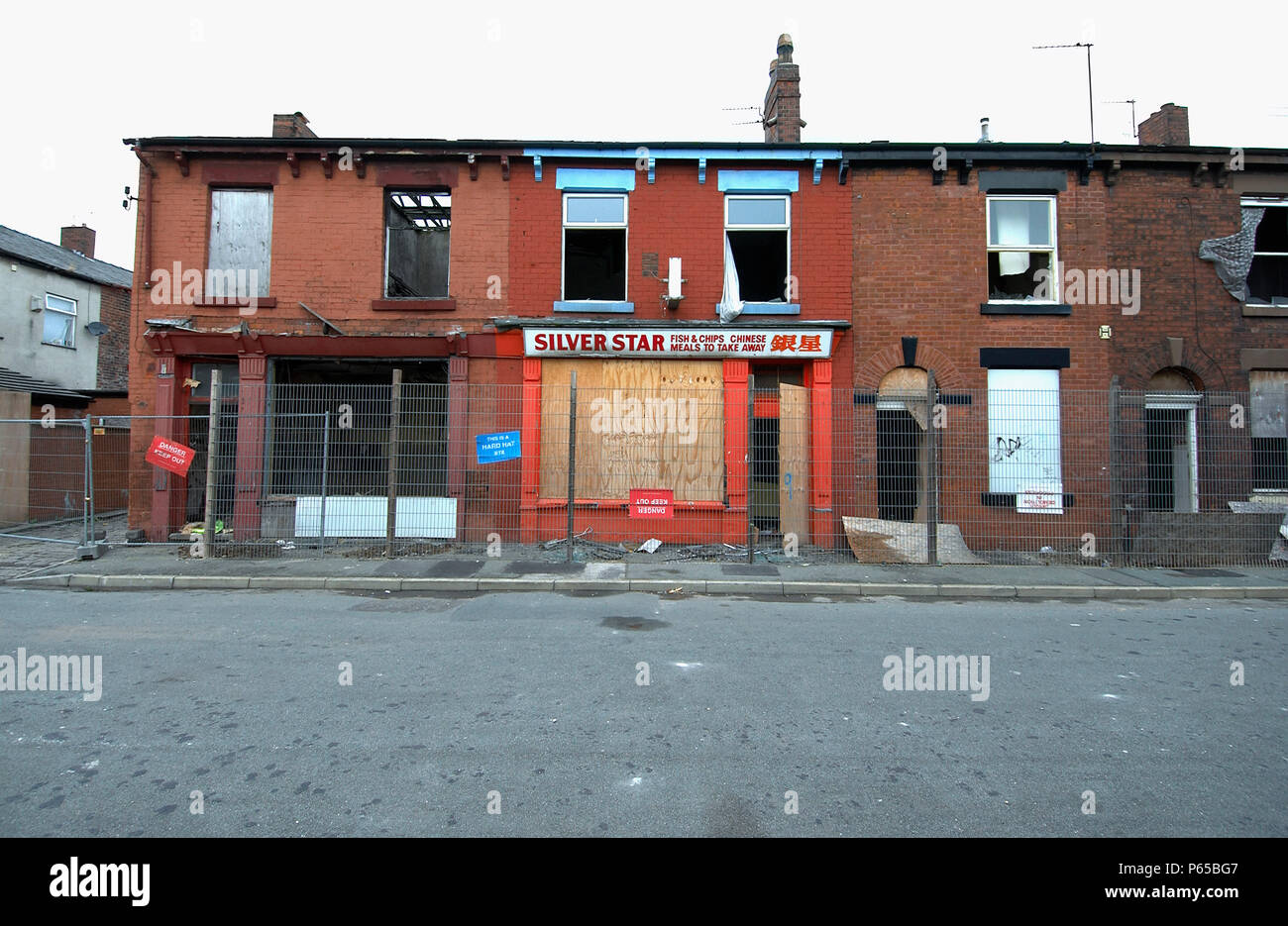Derelict terraced Victorian houses waiting demolition, Salford, near