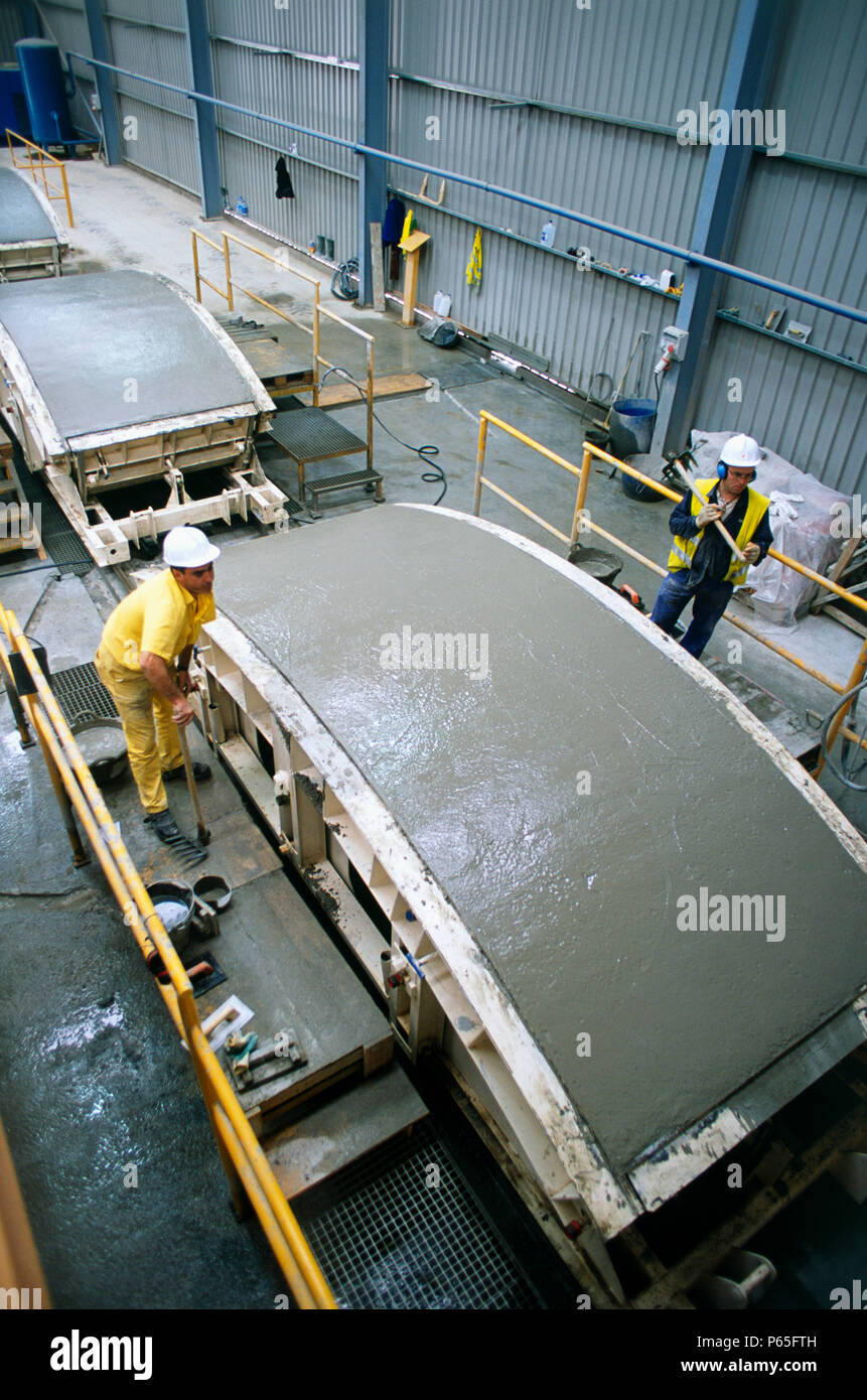 Trowelling Tunnel segment after hand trowelling moves on production track into ...