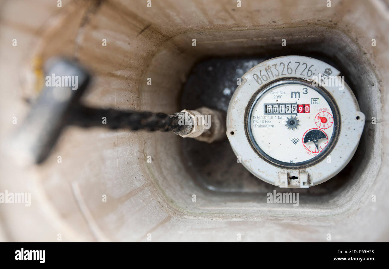 A household water meter. Climate change is already leading to water shortages in many parts of the world. Water meters change behaviour, and cause peo Stock Photo