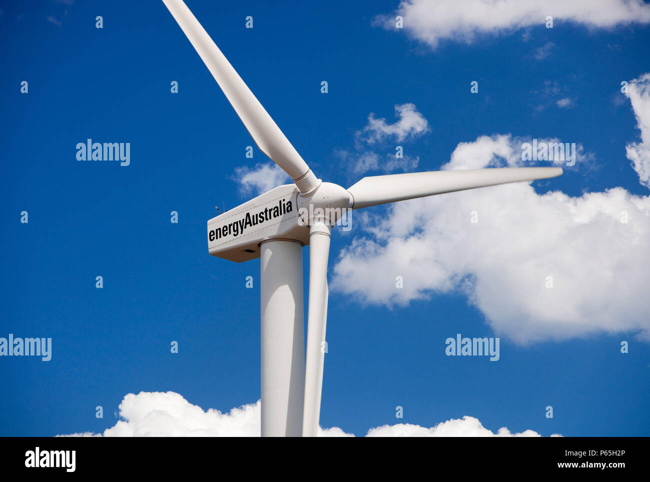 A lone wind turbine stands defiant pointing to a more sustainable future, in Newcastle, which is the worlds largest coal port, New South Wales, Austra Stock Photo